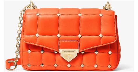 michael kors orange studded bag|Michael Kors quilted shoulder bag.